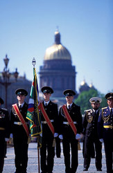 Guard the soldier of boundary armies at a banner on background Isak's cathedral